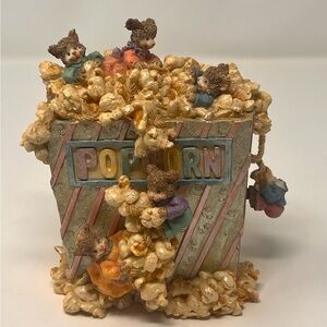 Vintage music box mice playing in a box of popcorn